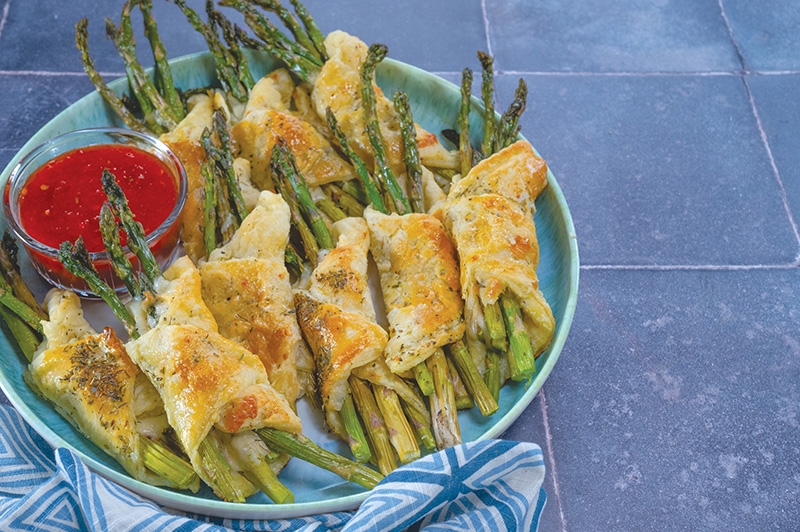 Plate of asparagus puff pastry bundles