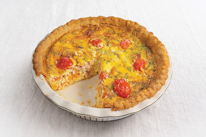 Prosciutto, Sun-Dried Tomato and Gruy&egrave;re Quiche in a pan