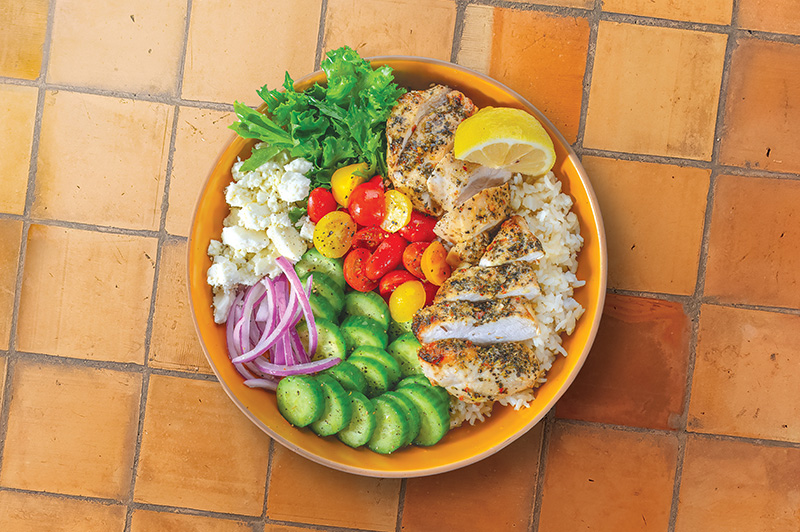 Greek Chicken Bowl in a bowl on a tile counter